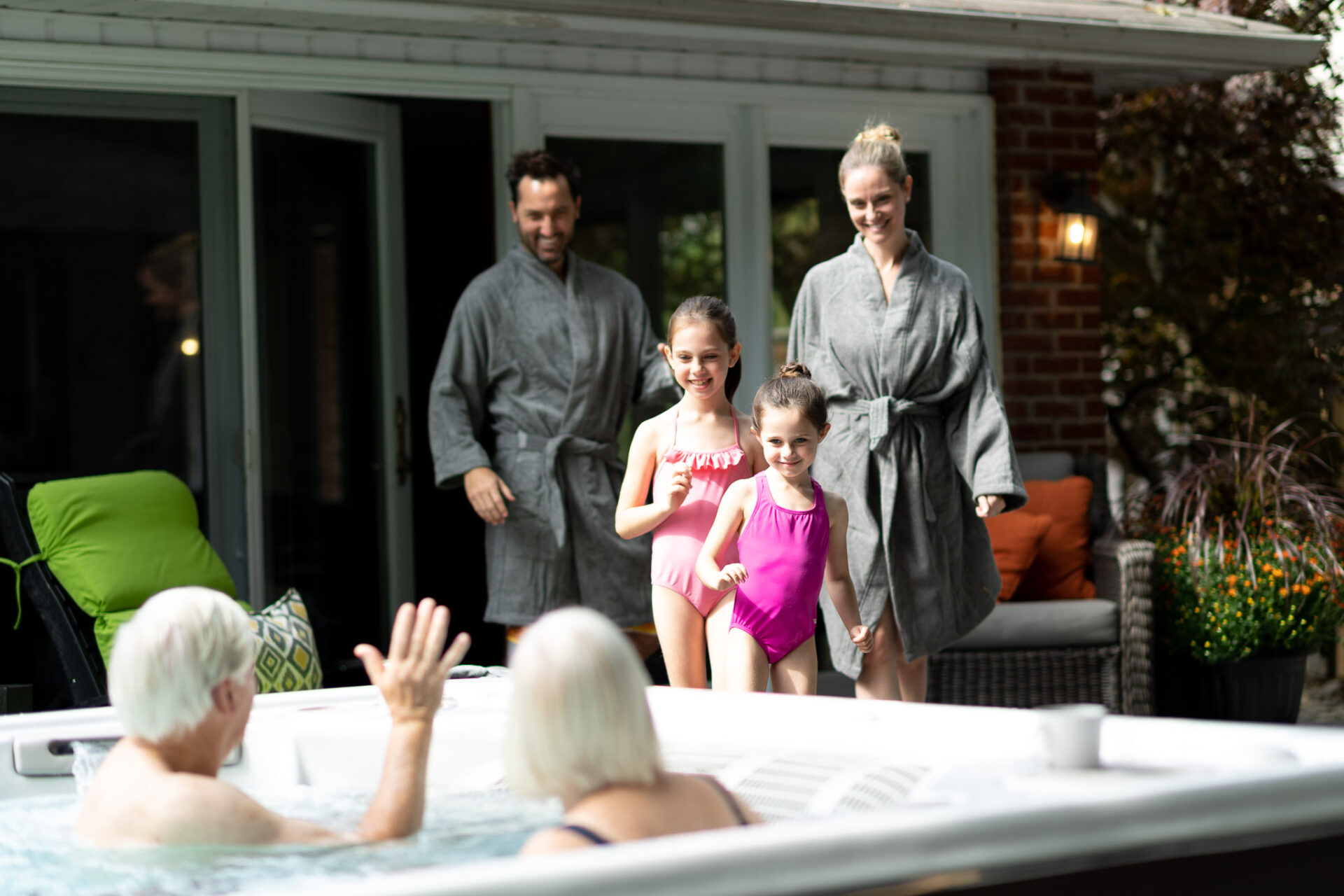 A family walking to use a swim spa