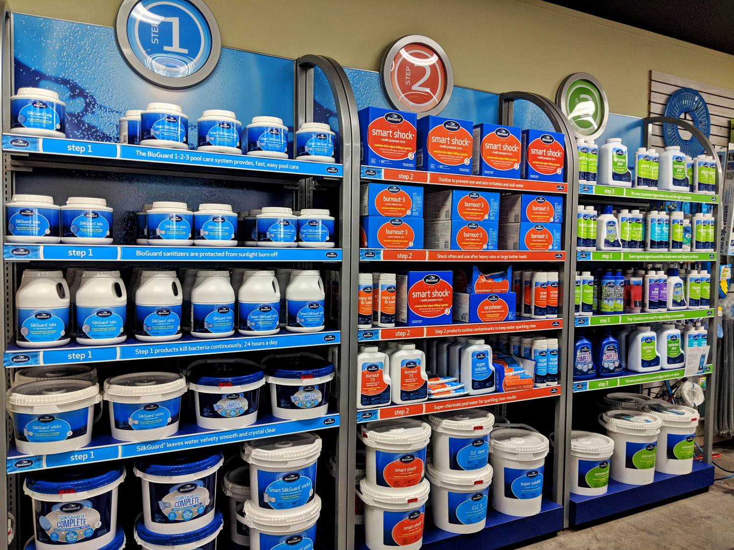 shelves of pool chemicals in a pool store